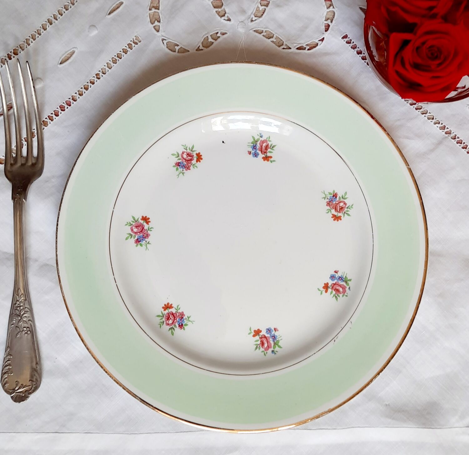 Flat antique earthenware plates with gilded edges