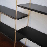 Shelf wall metal string