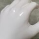 White ceramic hand wall lamp
