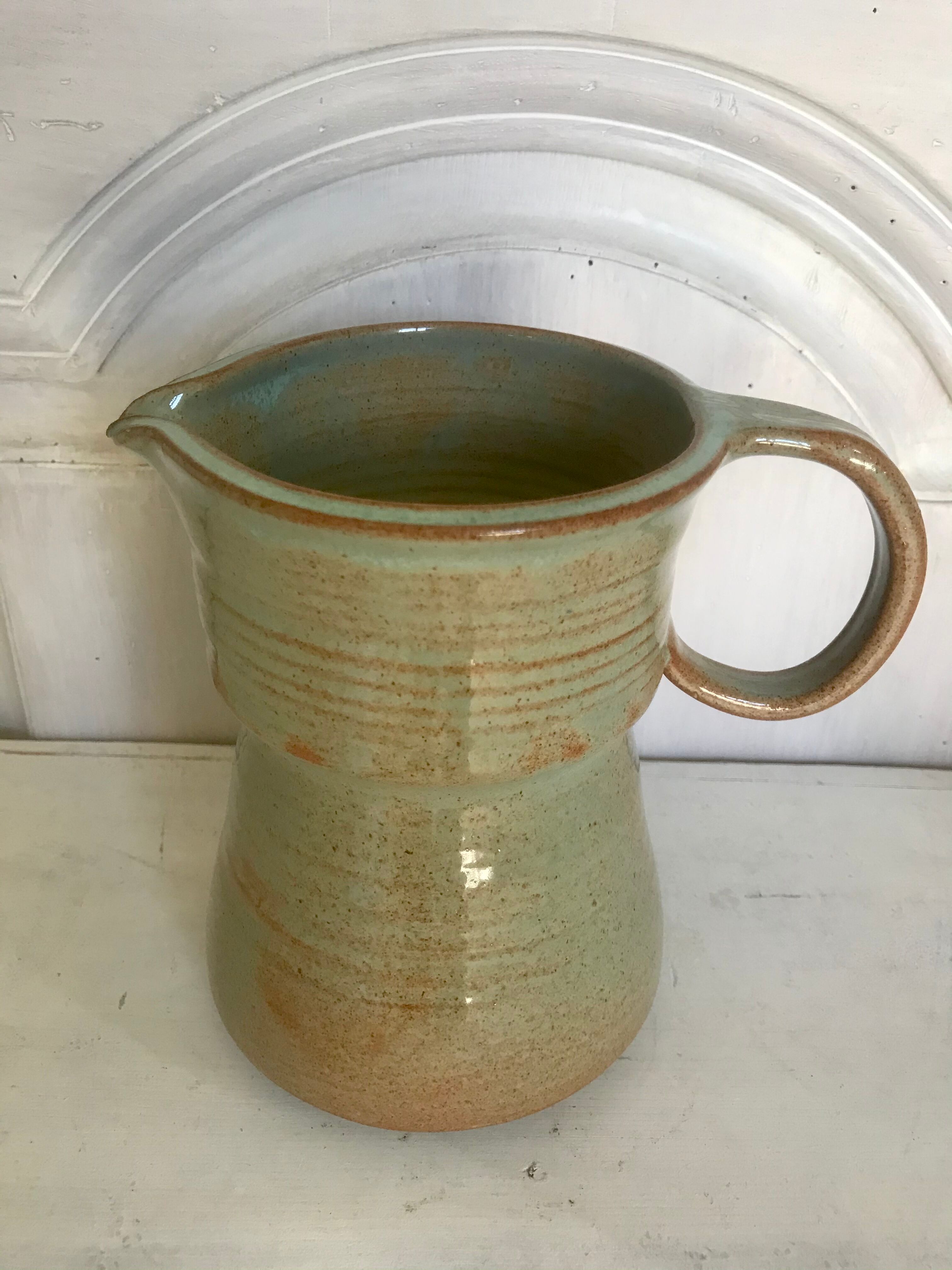 Pitcher and its vintage sandstone glasses