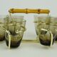 Set of 6 midcentury shot glasses in a brass holder with bamboo handle 1950s