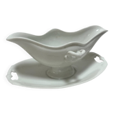 White porcelain sauce boat on tray