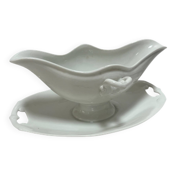 White porcelain sauce boat on tray