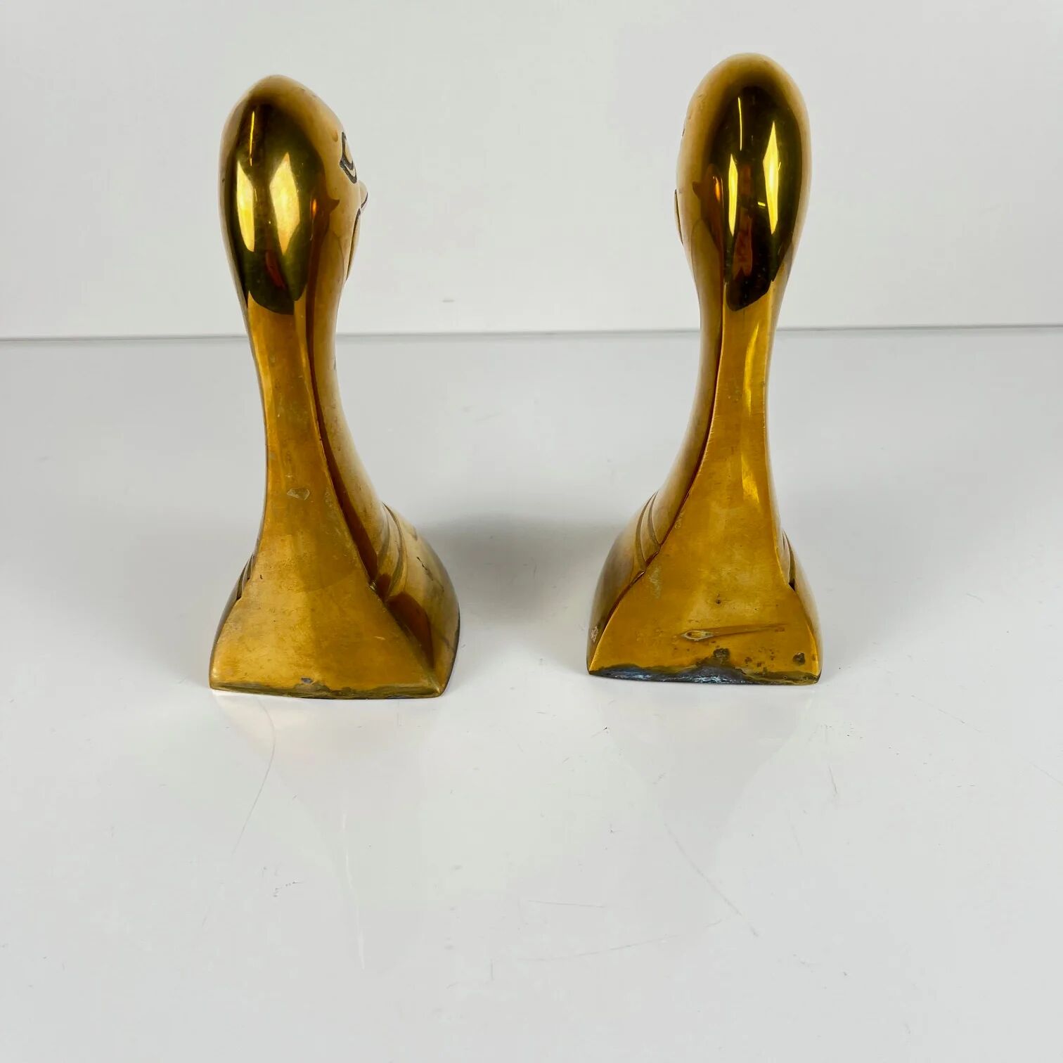 Pair of brass bookends in the shape of a duck's head, 1970.