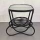Black rattan and glass coffee table
