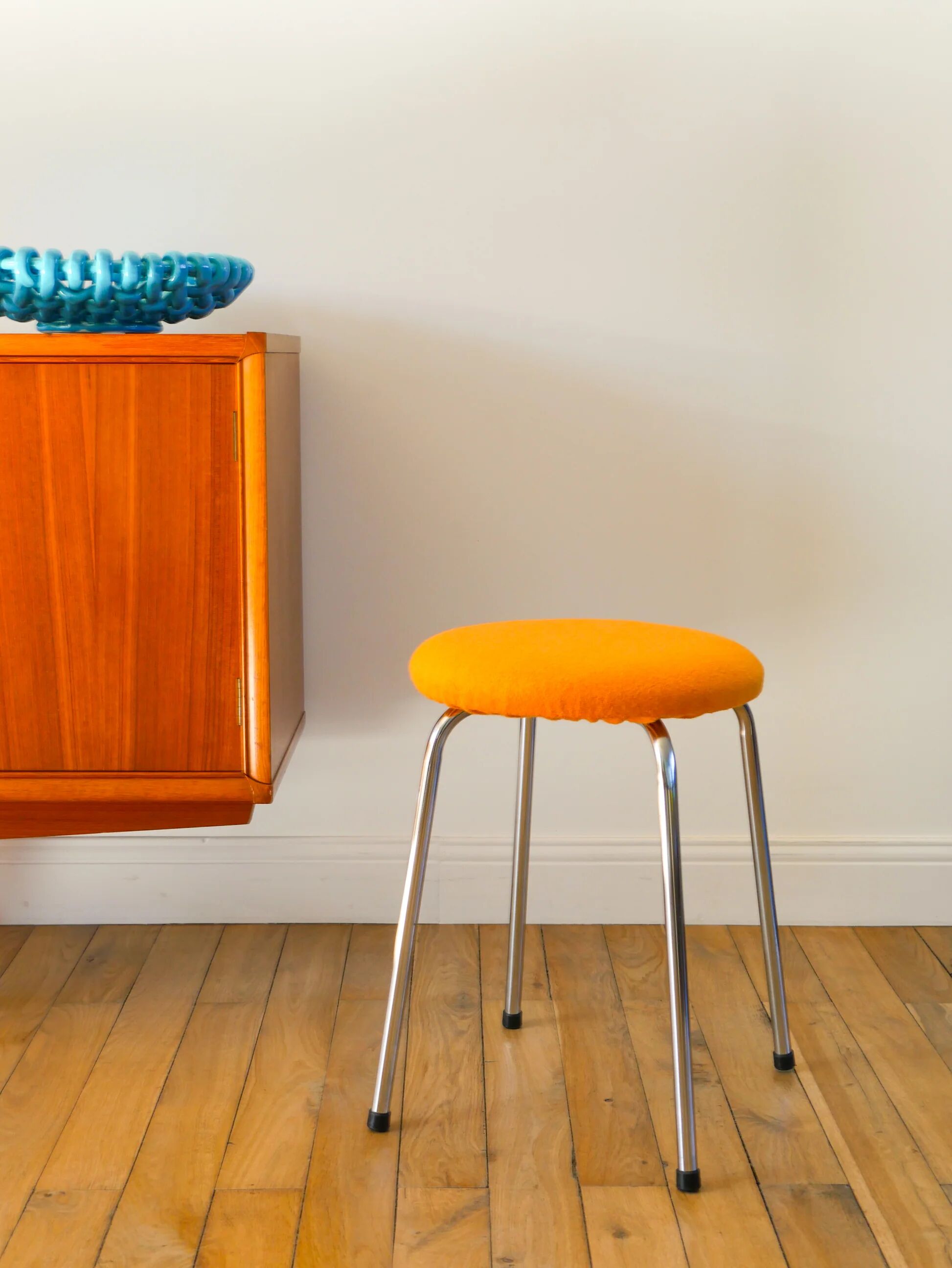 Chrome and boiled wool stool, orange, 1970.