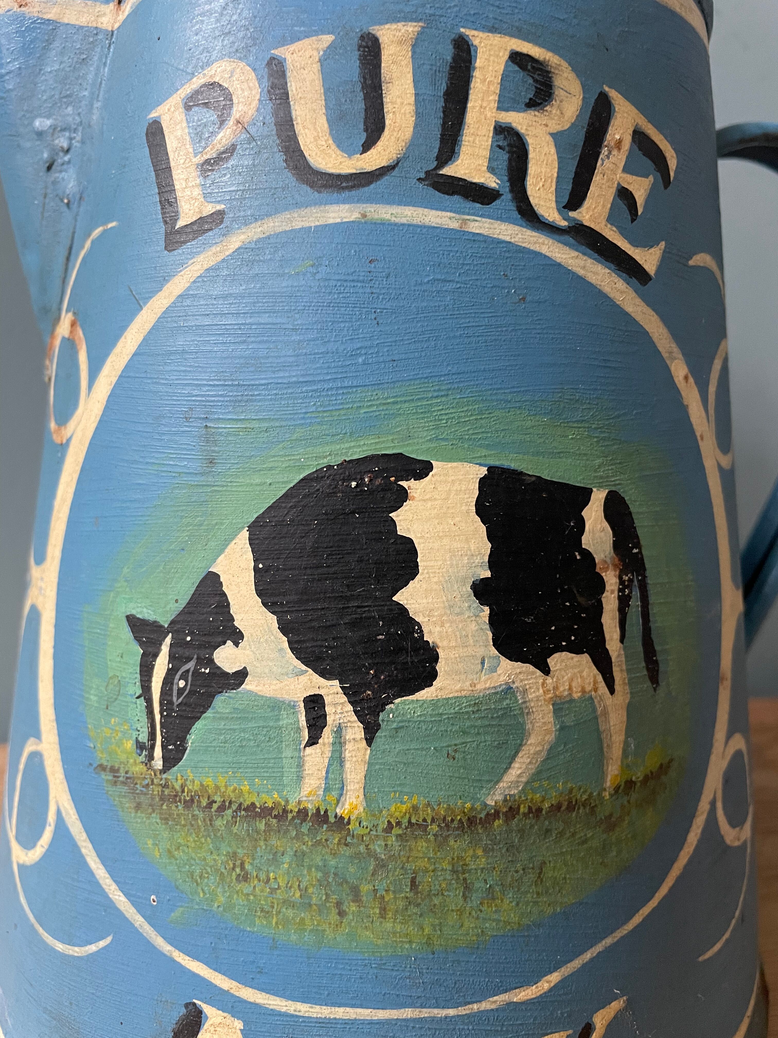 Old painted sheet metal jug or milk jug