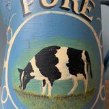 Old pitcher or milk jug in painted sheet metal