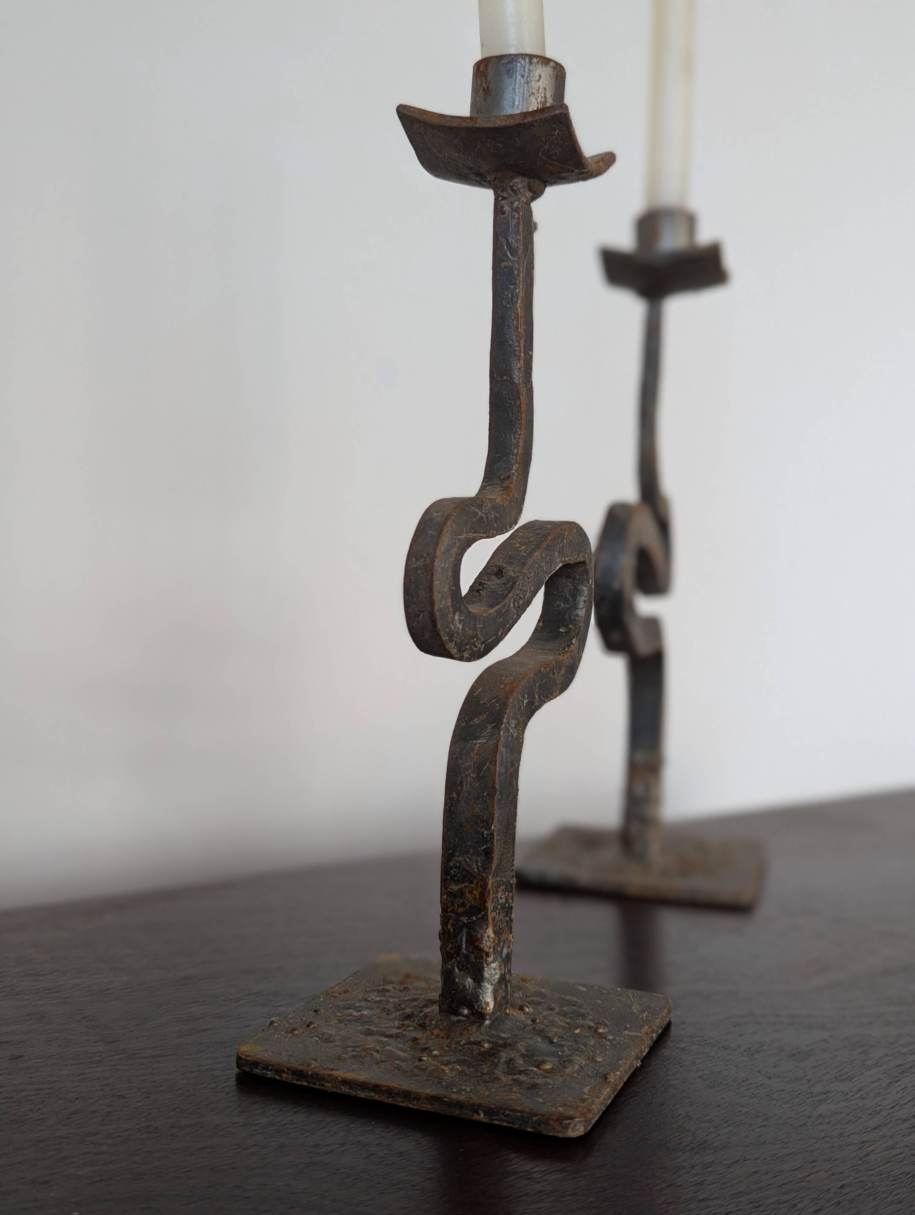 Pair of wrought iron candlesticks