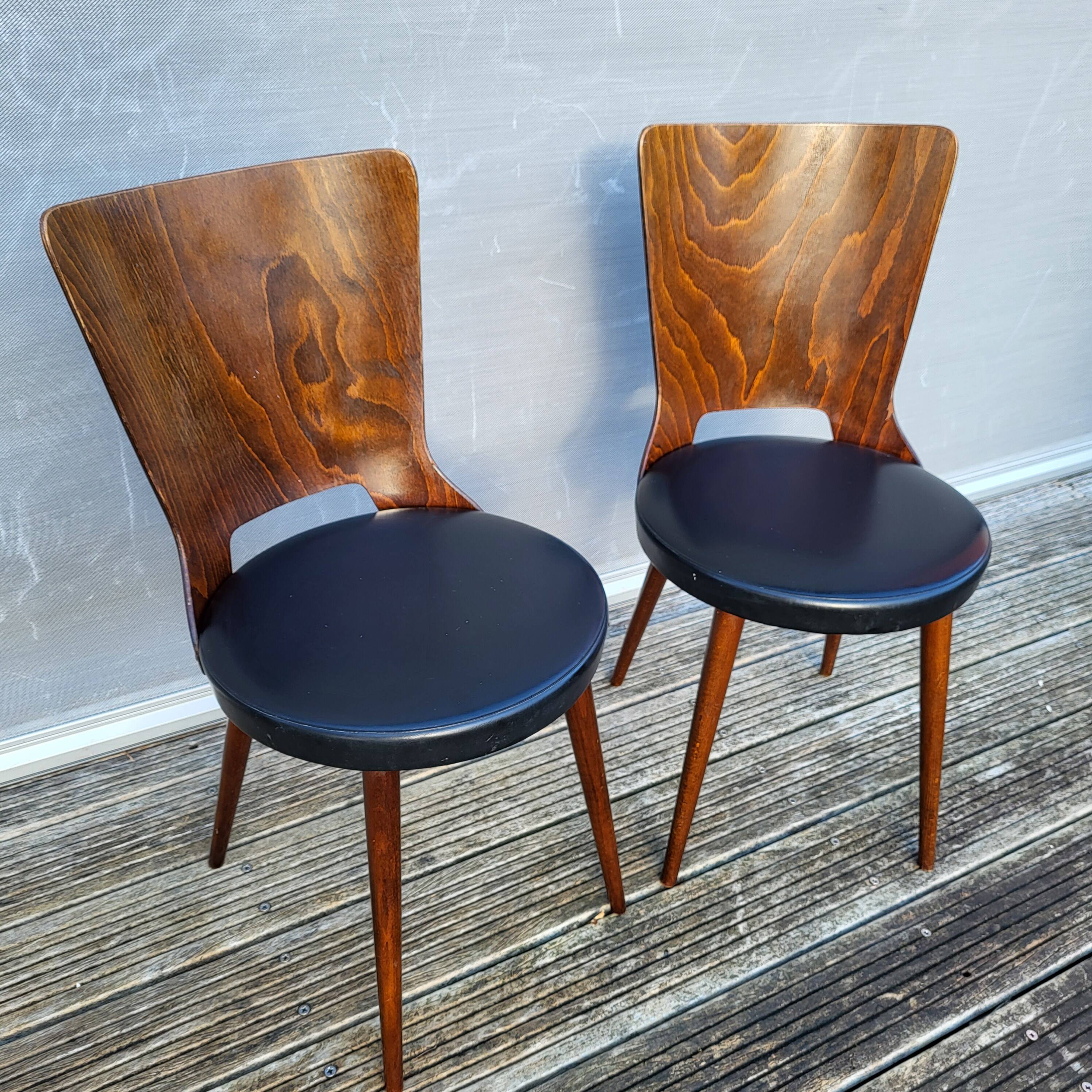 Pair of Dove chairs • Baumann • Black faux leather