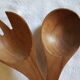 Set of rosewood salad cutlery and striated sleeve