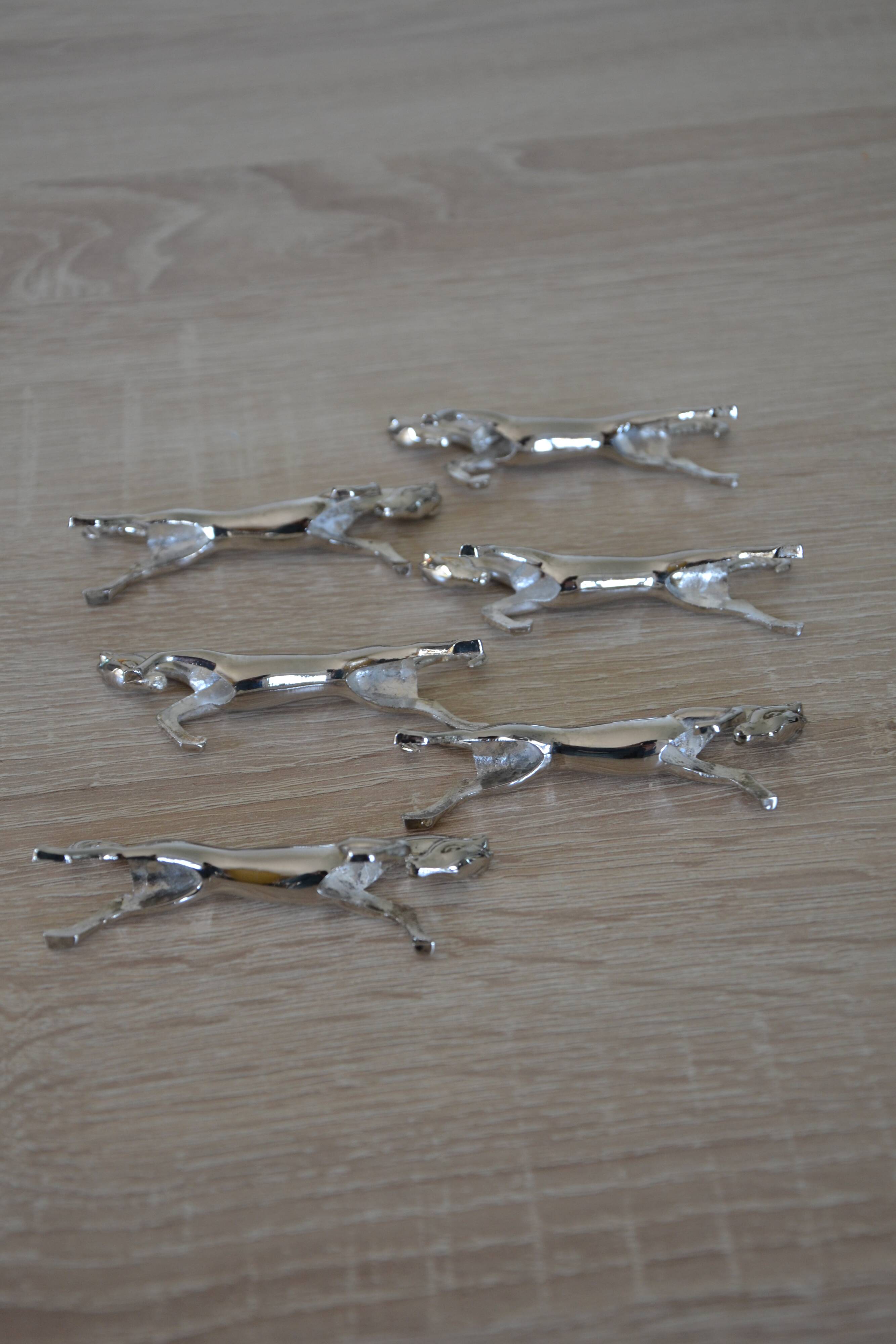 6 silver-plated "horse" knife rests