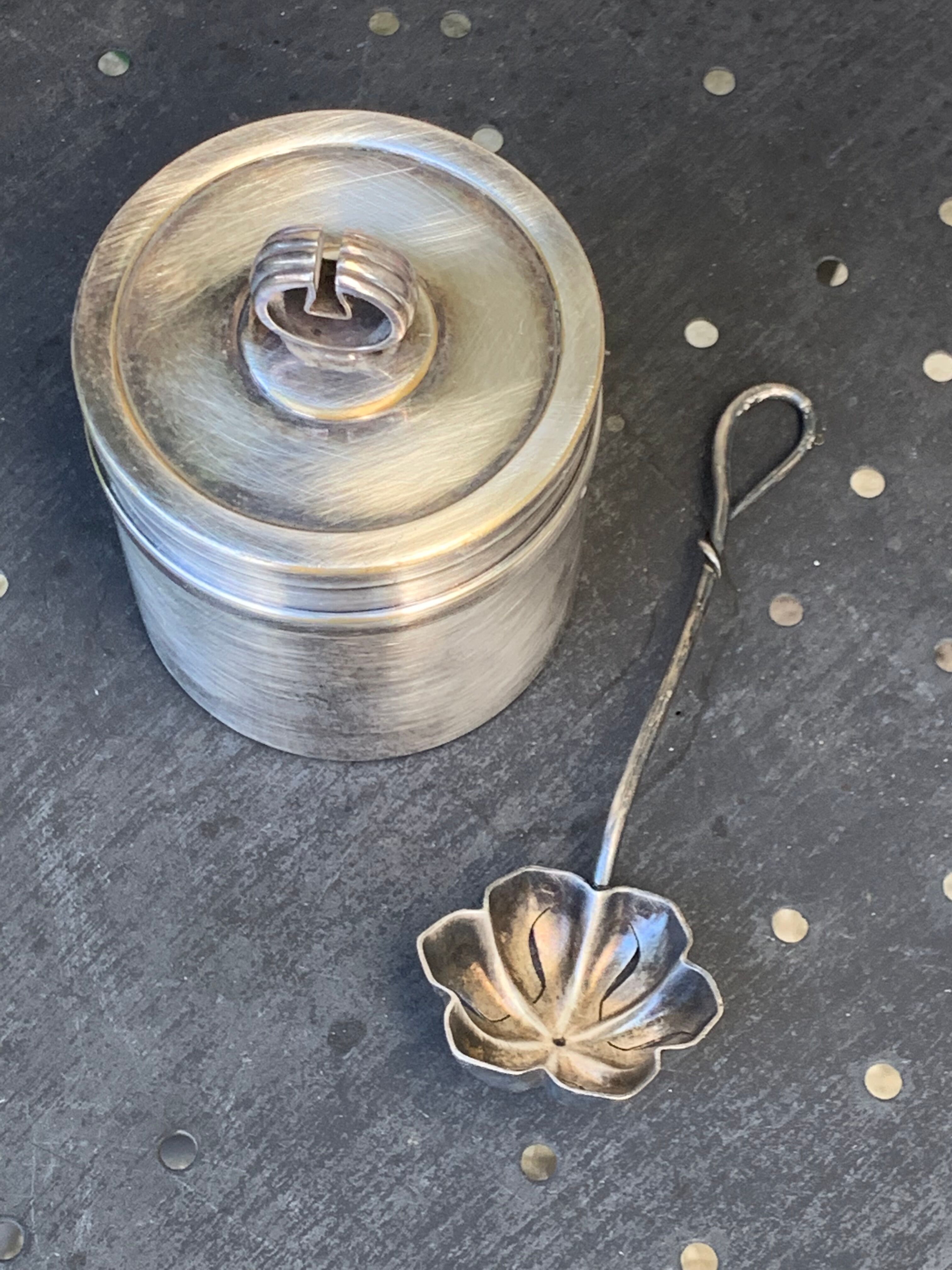 Sprinkling spoon and art deco sugar pot in silver metal