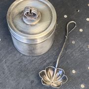 Sprinkling spoon and art deco sugar pot in silver metal