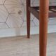Danish 1960s teak coffee table with slatted shelf.