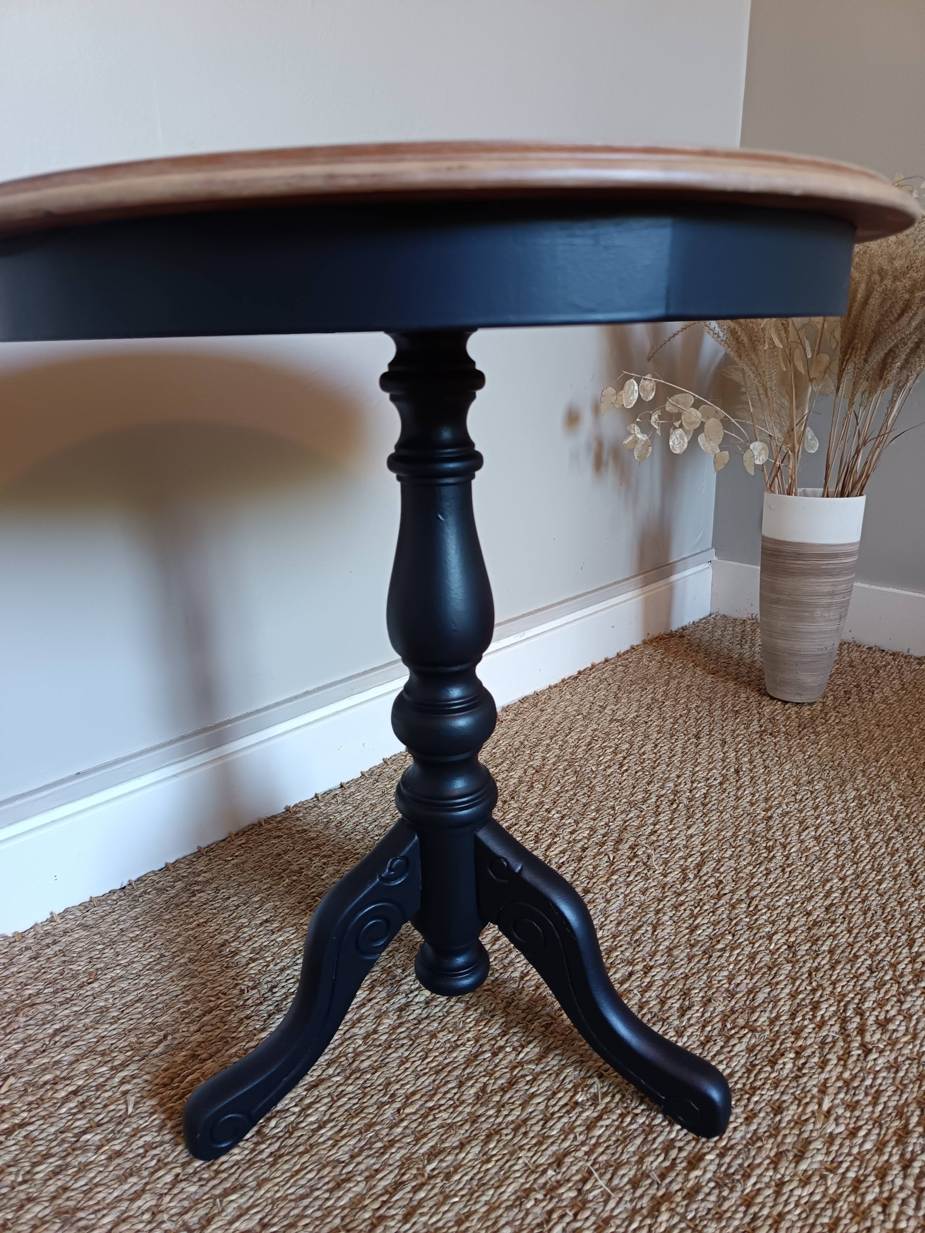 Marquetry pedestal table with black legs