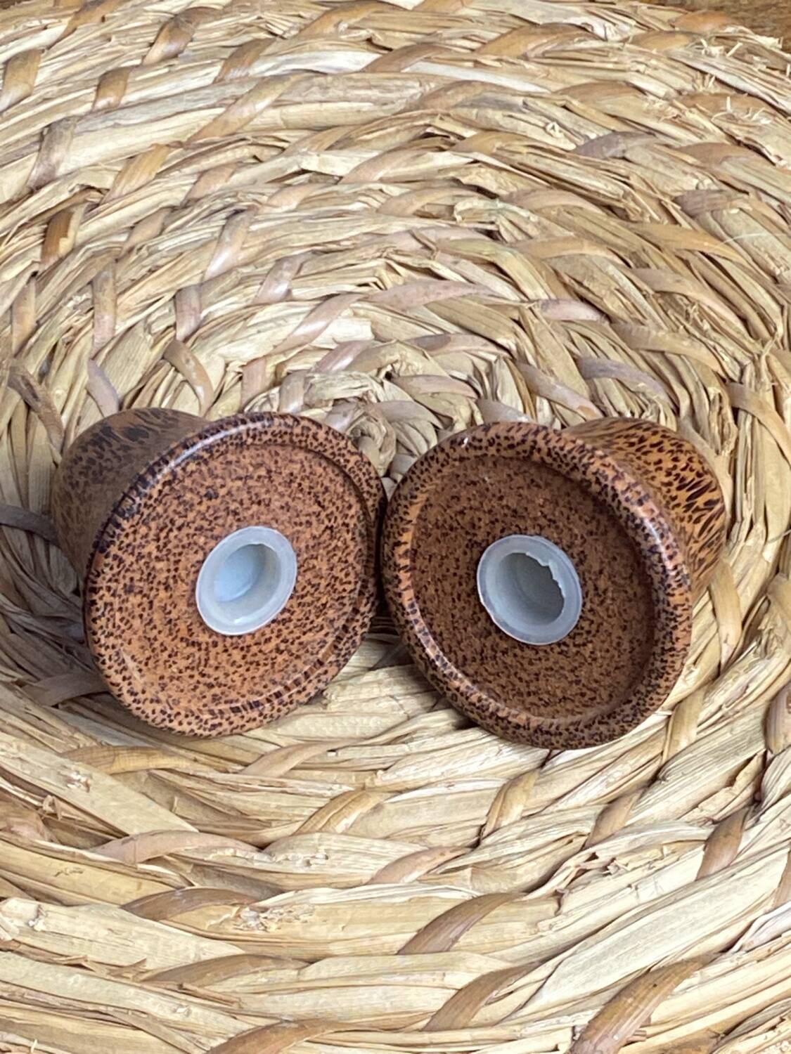 Salt and pepper shakers, bell-shaped, made of wood.