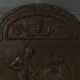 EIGHTEENTH CENTURY CAST IRON FIREPLACE PLATE REPRESENTING A WOMAN AND A WOLF