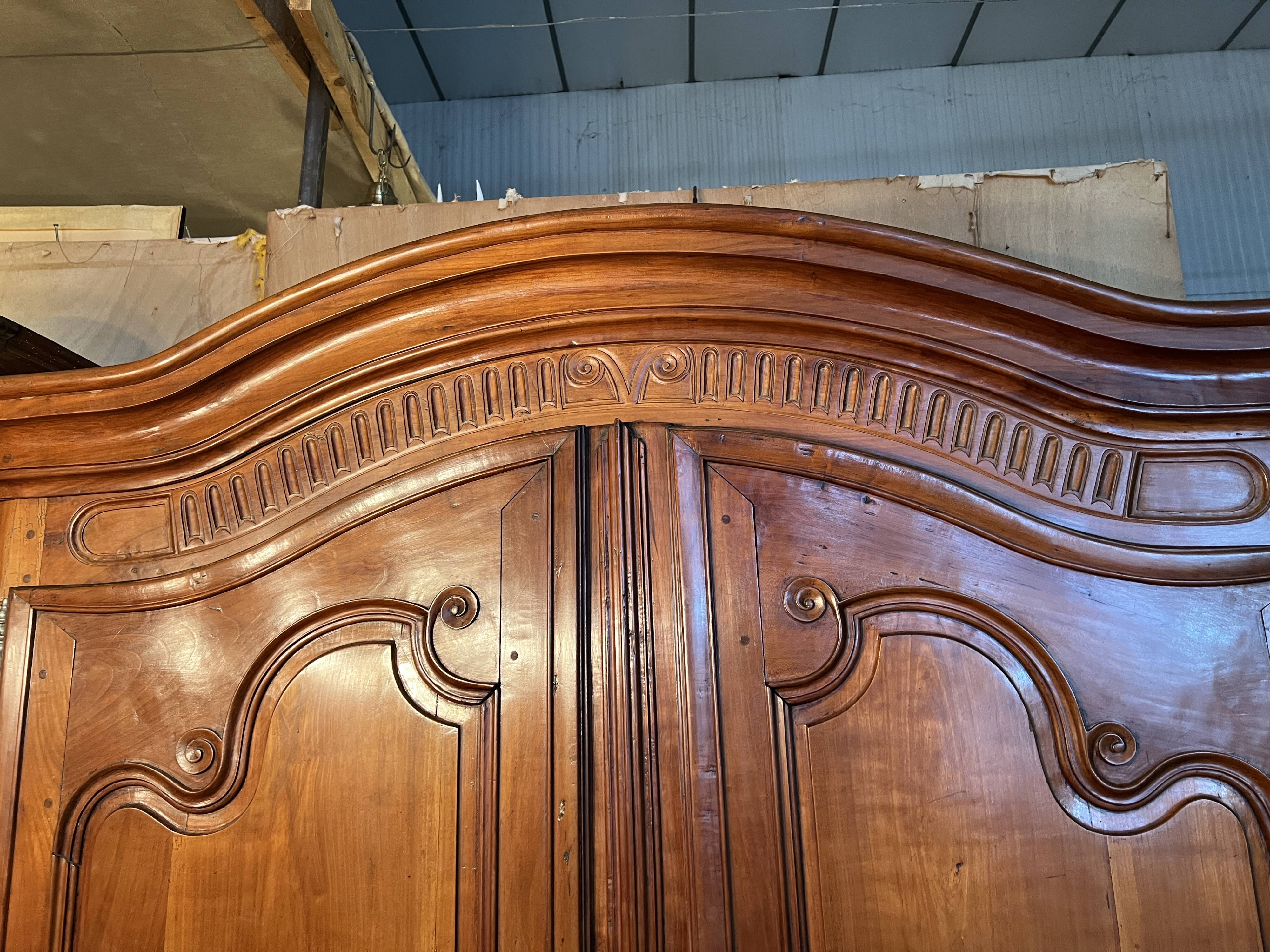Louis XV wardrobe with two doors, Cherry wood. 18th century.