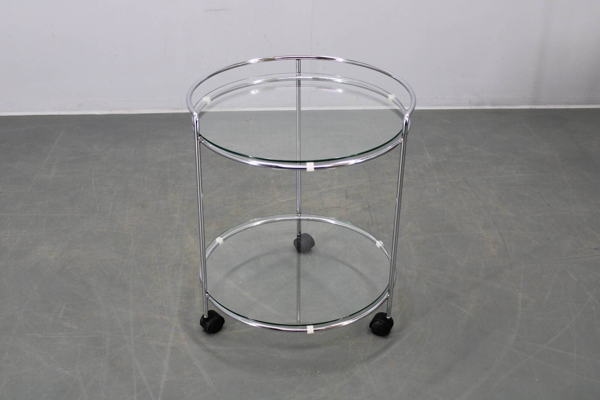 Mid-century round serving table, chrome and glass, Italy, 1980s