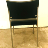 Suite of eight vintage chairs in chrome and imitation leather XX century