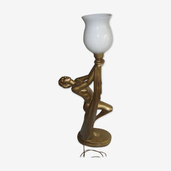 Lamp depicting a with a drape