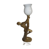 Lamp depicting a with a drape