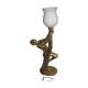 Lamp depicting a with a drape
