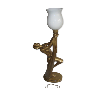 Lamp depicting a with a drape