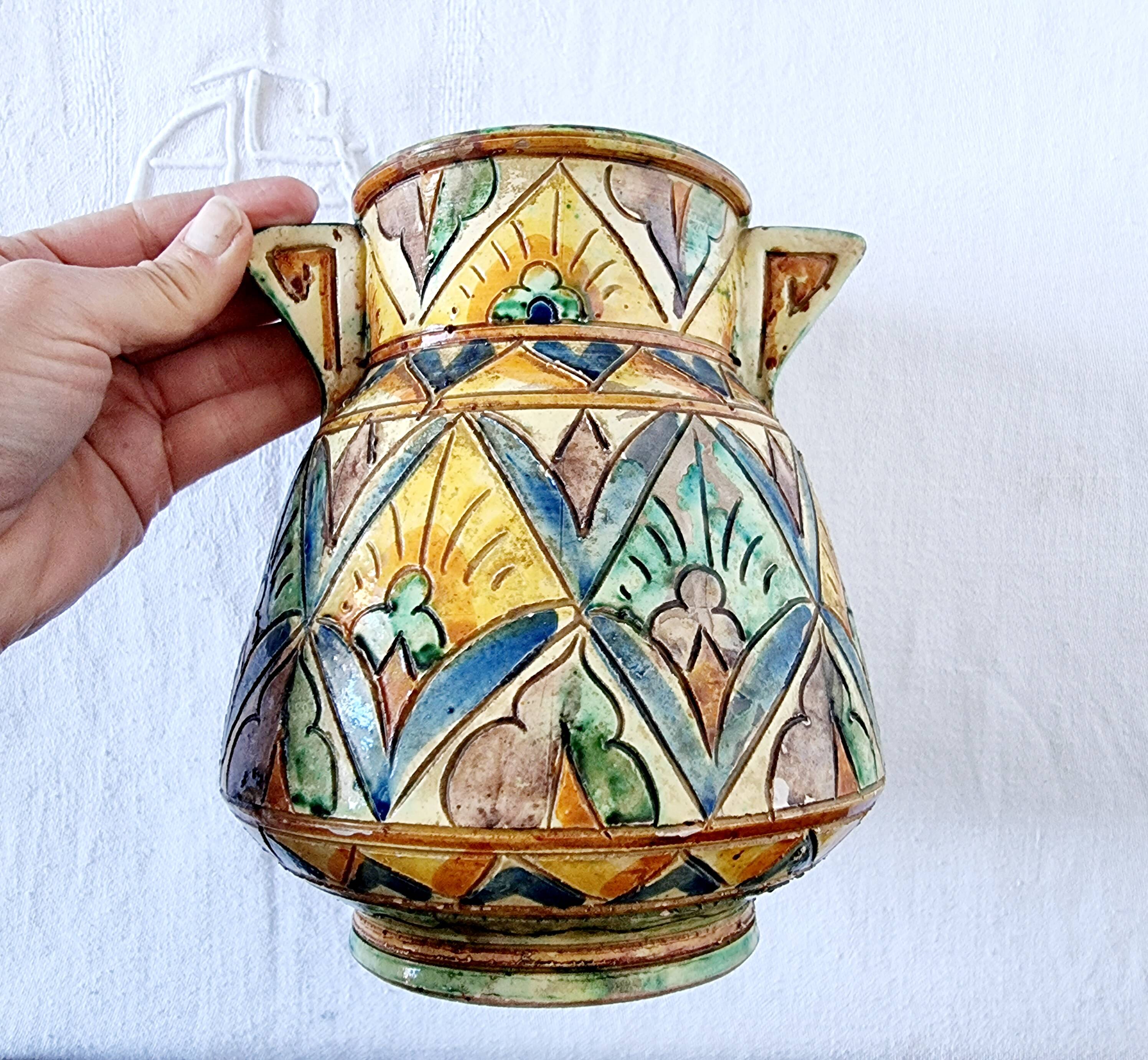 Antique majolica water pitcher made in Italy and hand painted.
