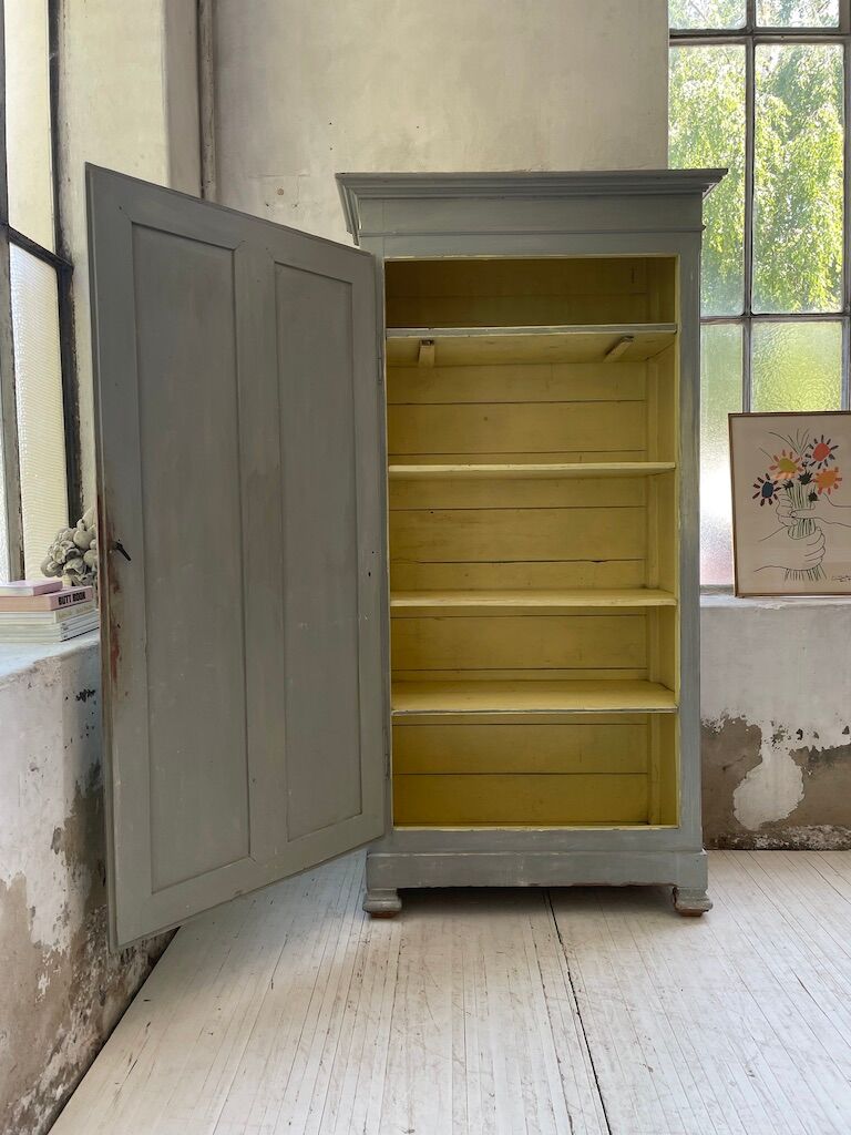 Blue patinated cap cabinet