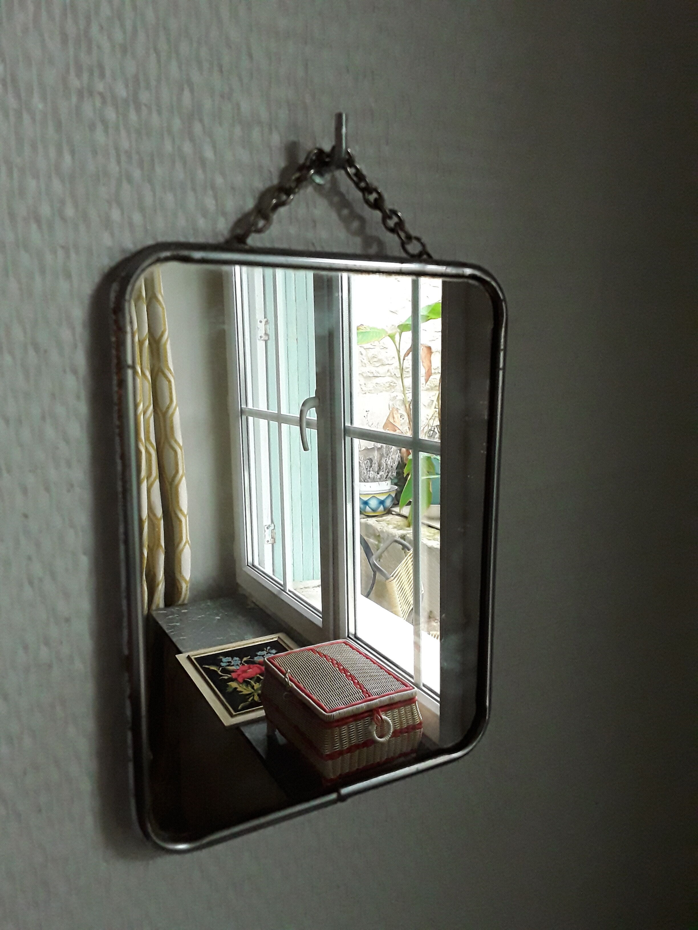 Vintage barber mirror with chain