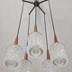 Mid Century Modern spider chandelier in teak, rosewood, and crystal.