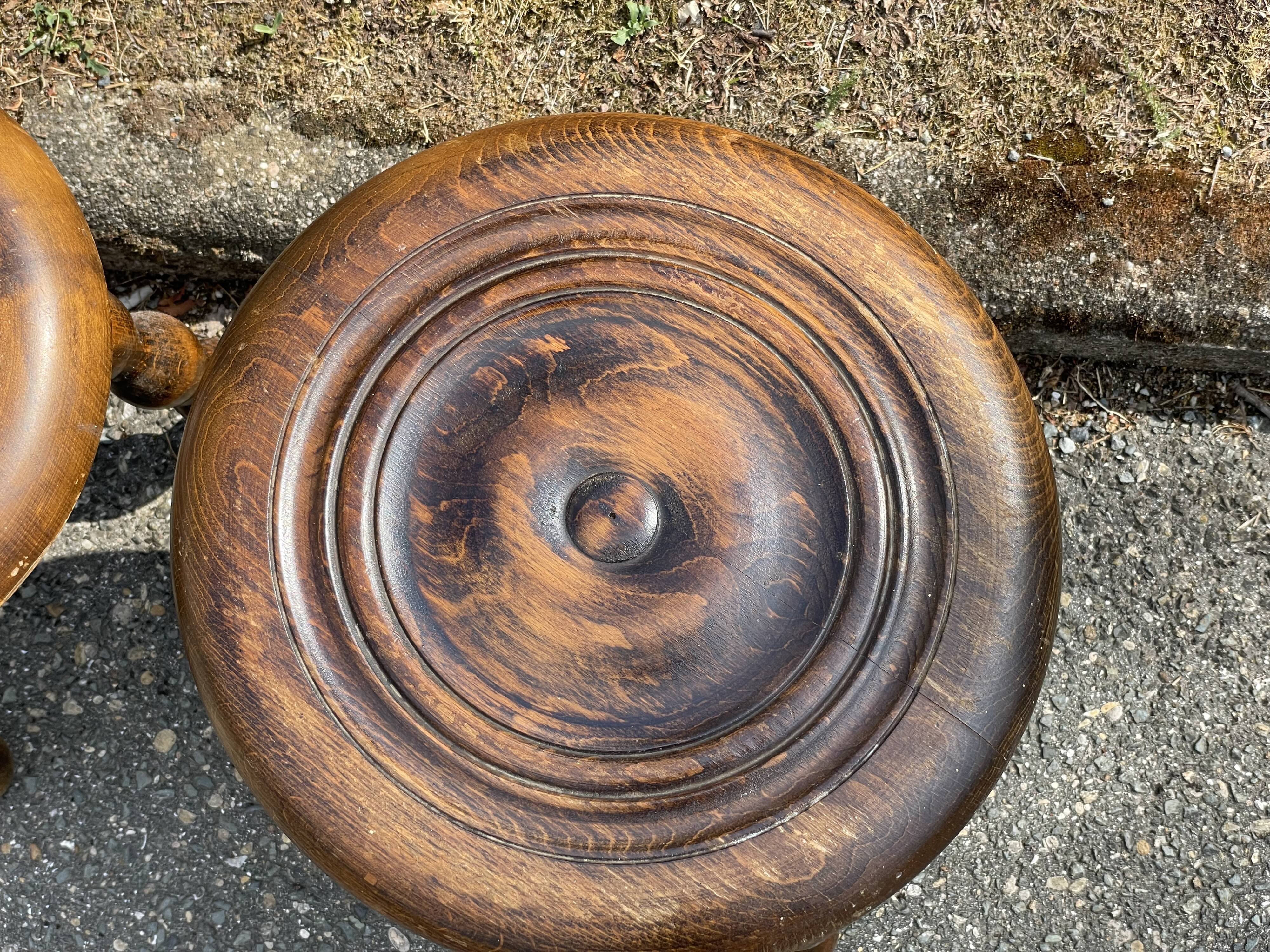 Duo of tripod oak stools