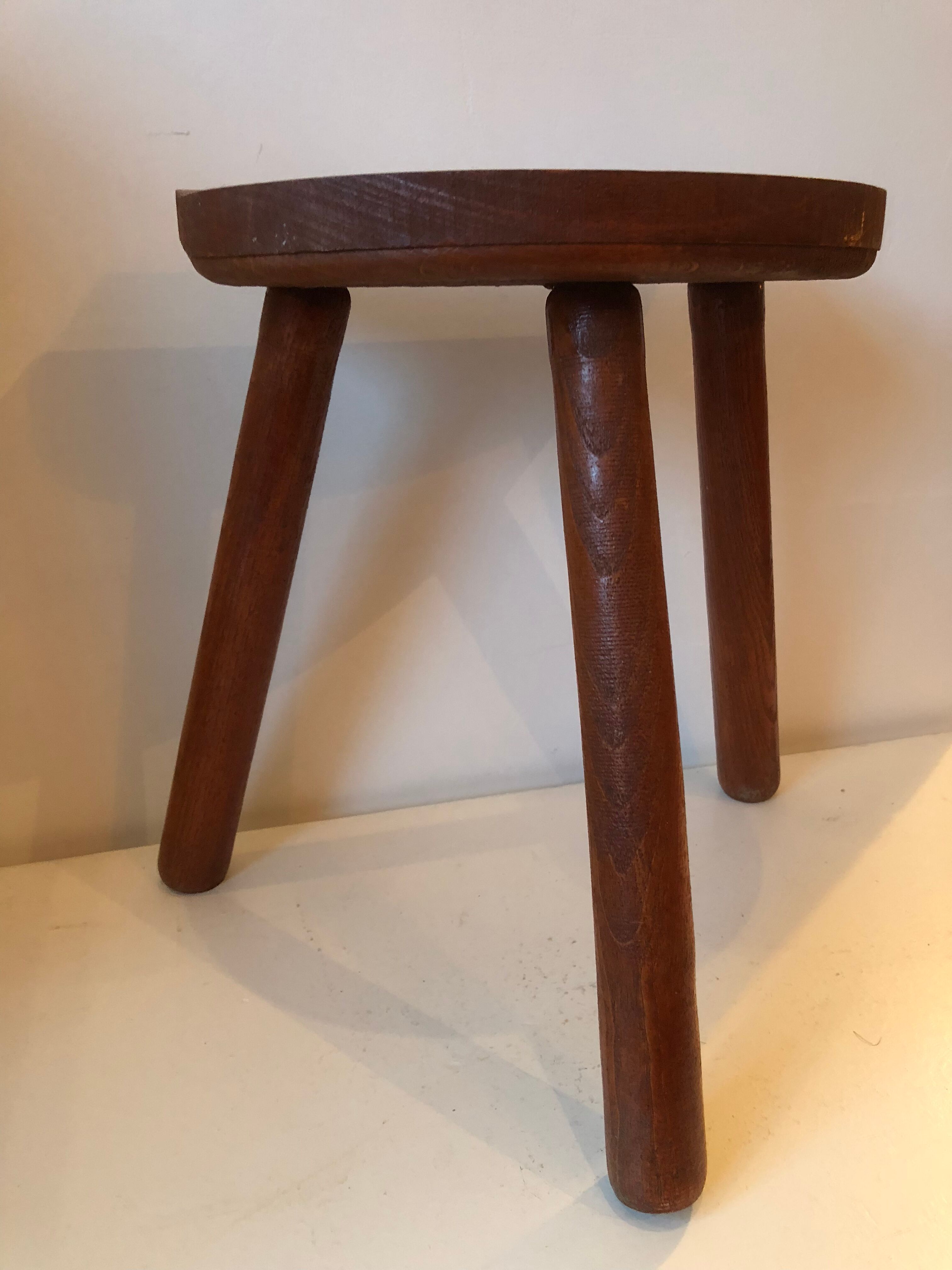 Old wooden tripod stool