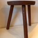 Old wooden tripod stool