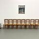 Set of 8 chairs in solid elm with straw seats.