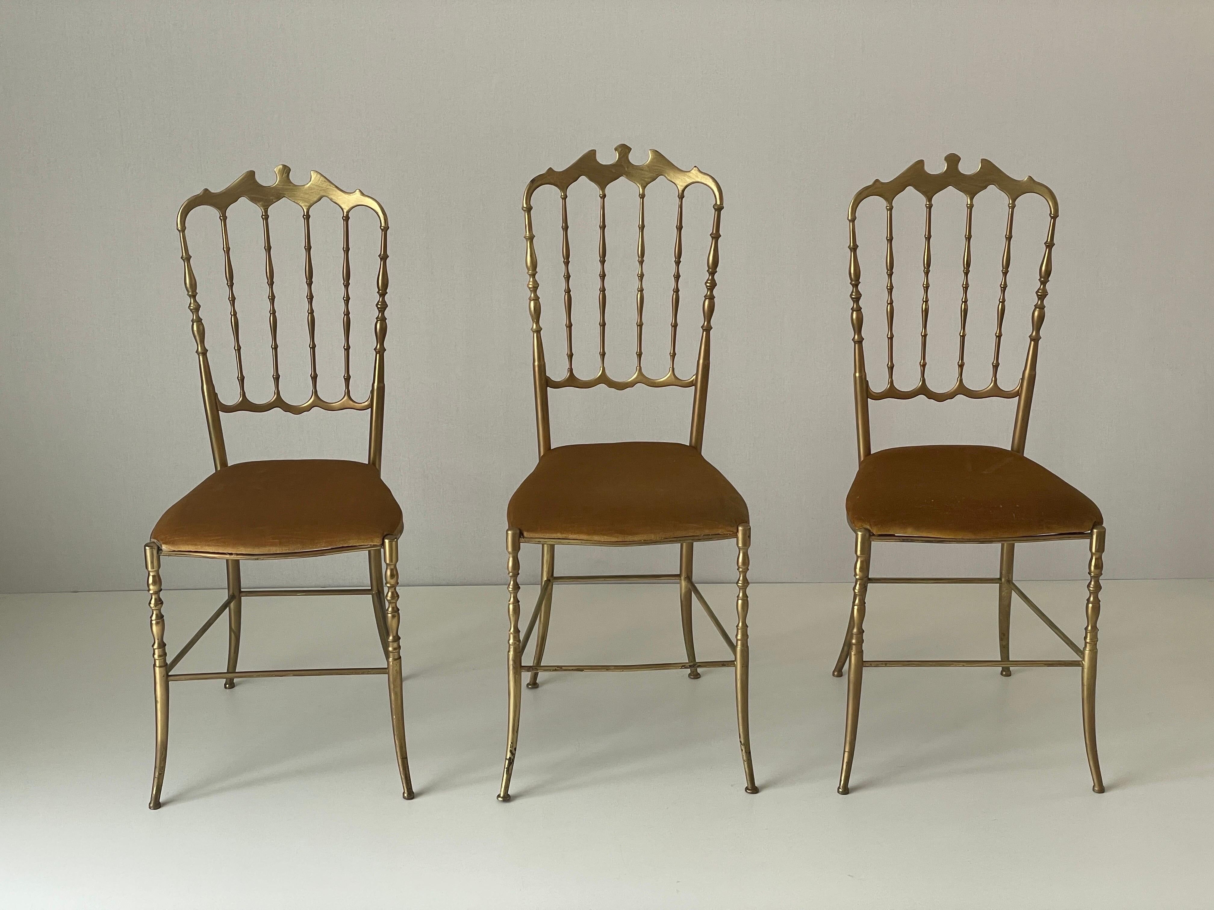 Set of 3 Chiavari chairs in brass with velvet seat and high back, 1950s, Italy.