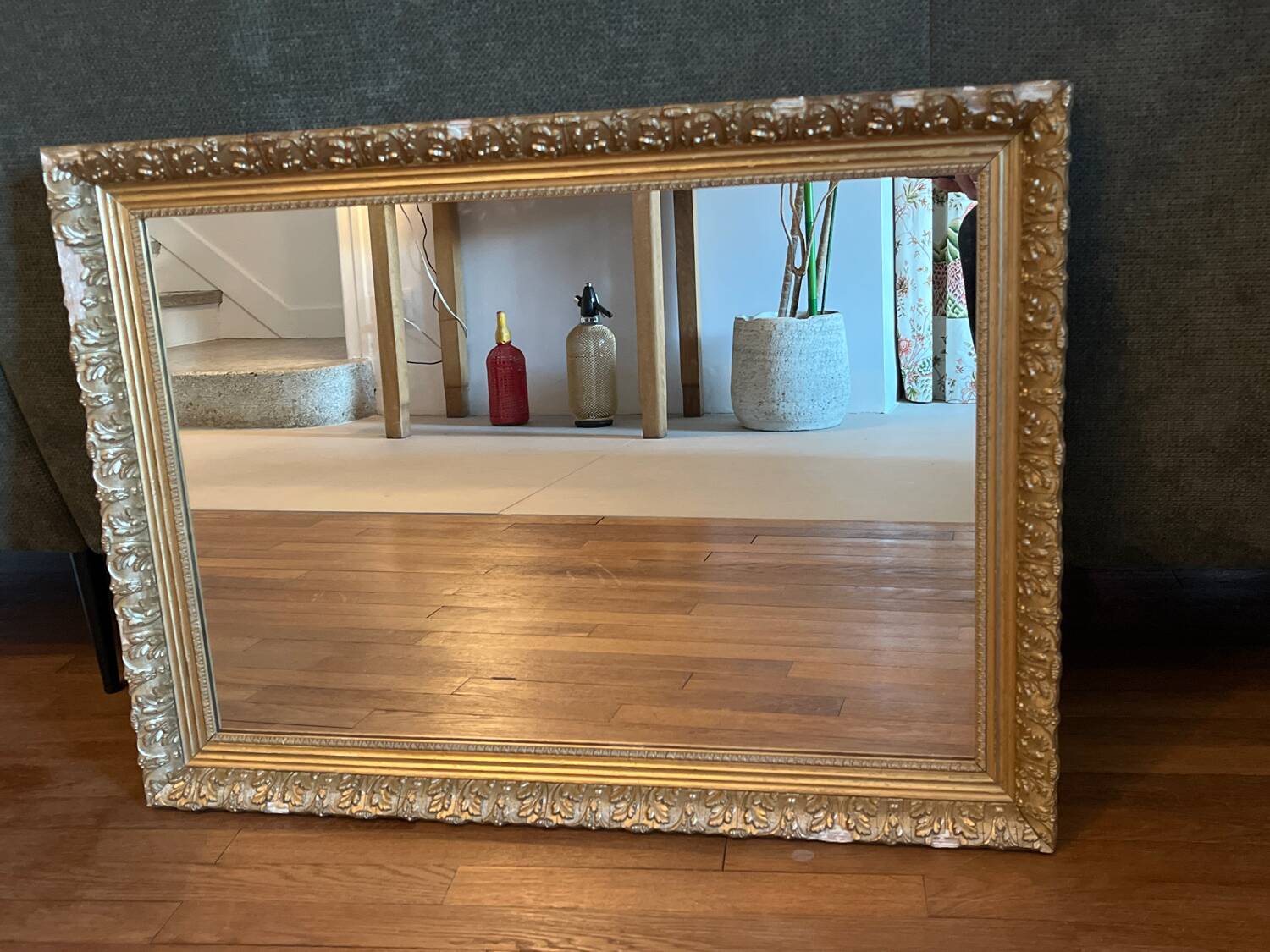 Antique mirror with a wooden and gilded stucco frame.
