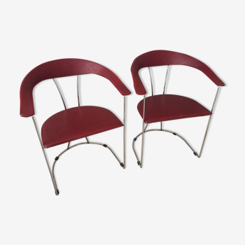 Pair of red chairs in 80s skai