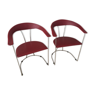 Pair of red chairs in 80s skai