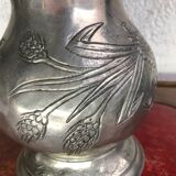 Tin pitcher decorating bunch of grapes