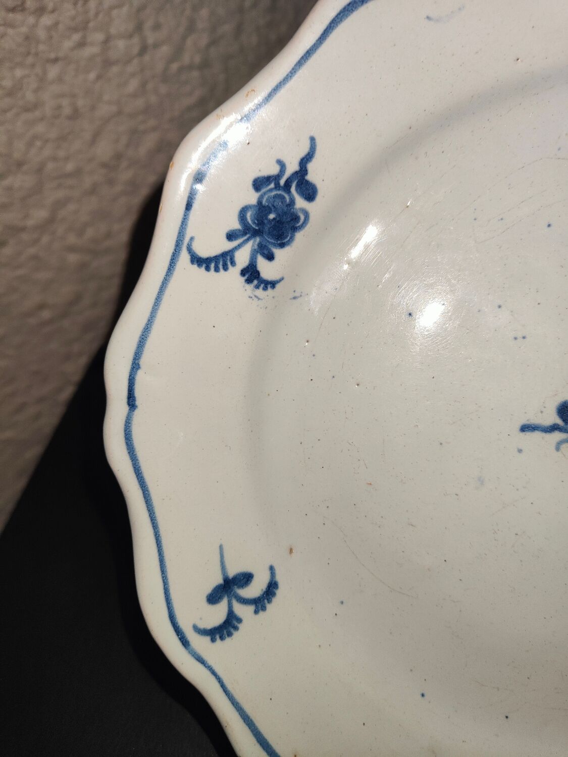 Old plate in Northern earthenware with blue floral decoration eighteenth century