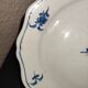 Old plate in Northern earthenware with blue floral decoration eighteenth century