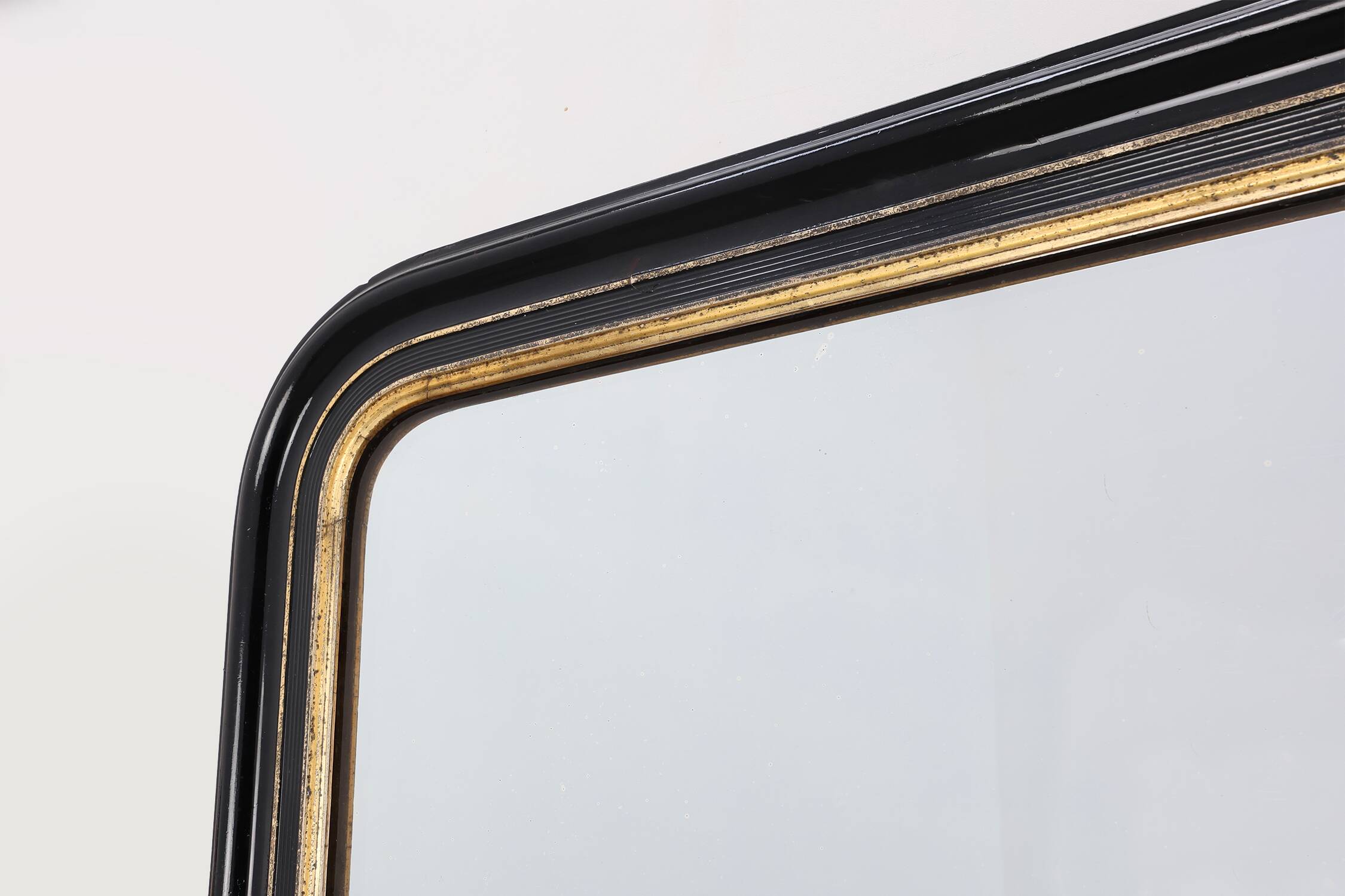 Black laquered and gilted wooden Louis Philippe mirror, France ca. 1850