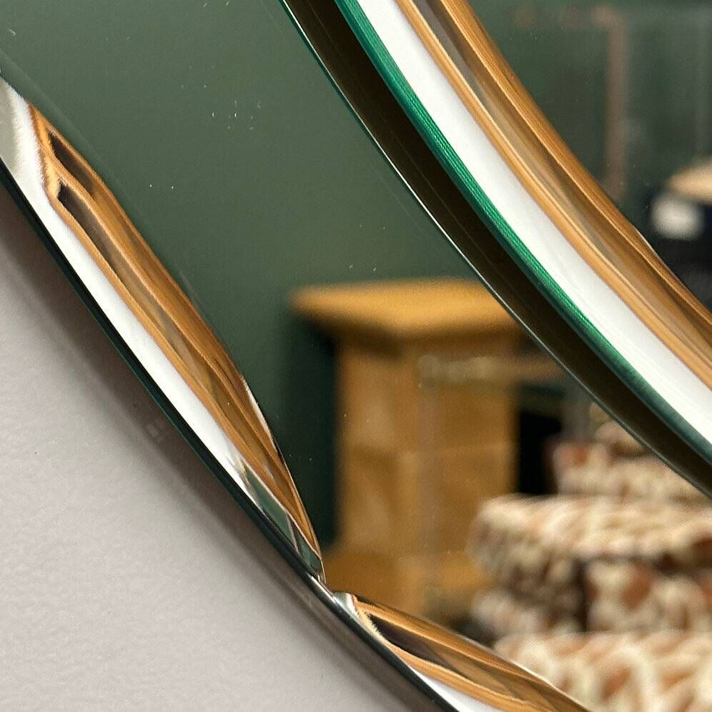 1970s Italian oval mirror by Crystal Arte with faceted glass frame