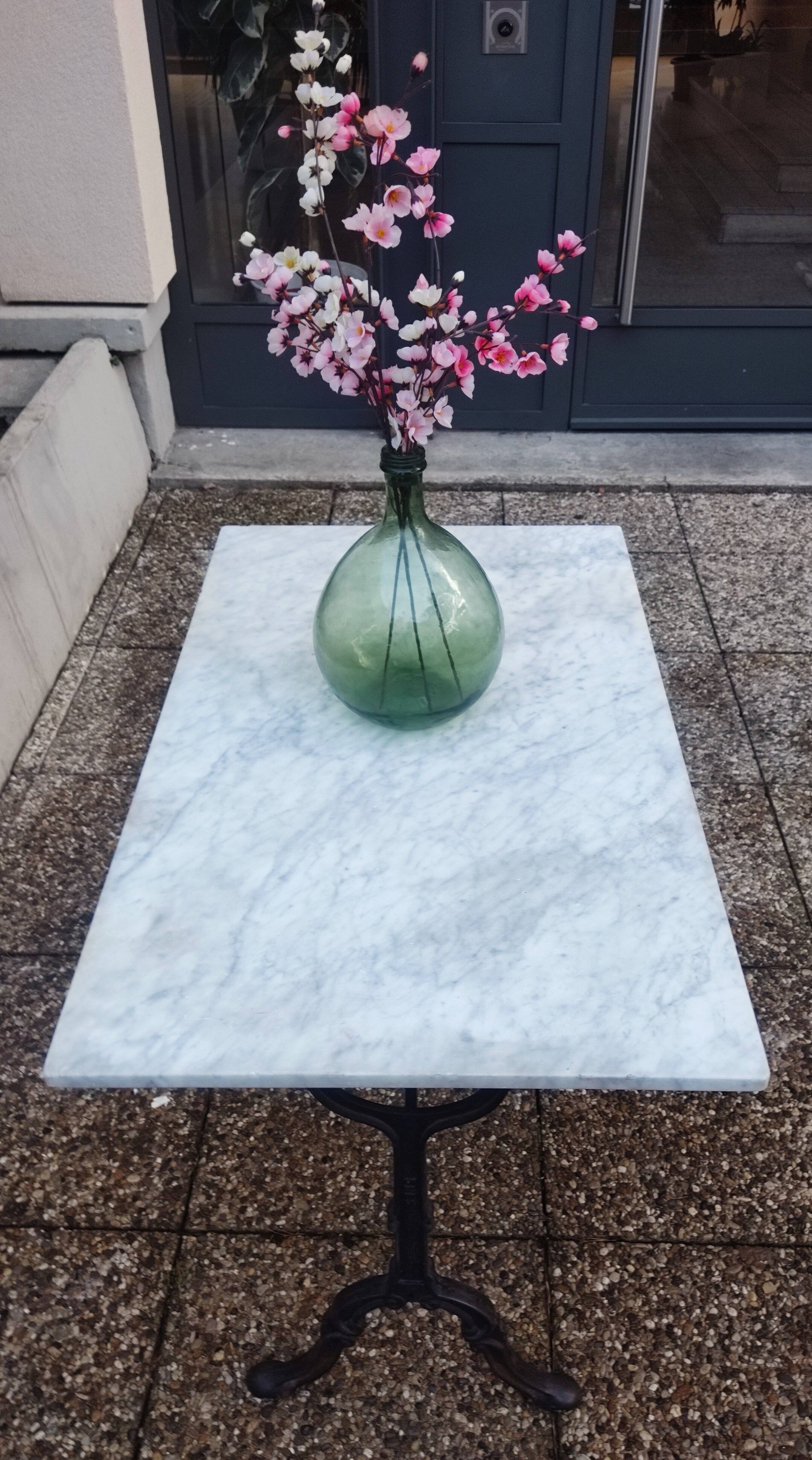 White marble table, cast iron base signed SNES, made in France