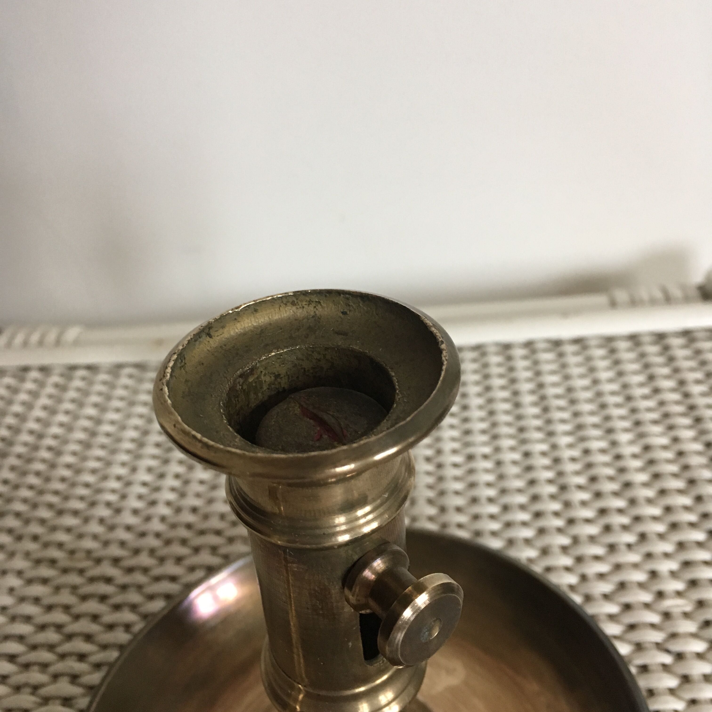 Old brass candlestick called "rat tail"