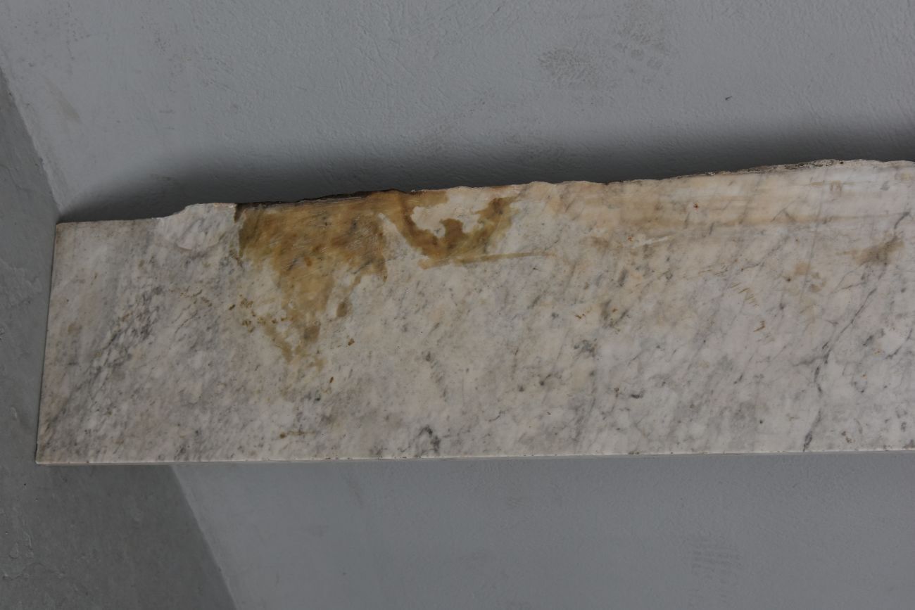 Old fireplace in white marble veined Louis XVI