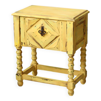 Large yellow patinated bedside table